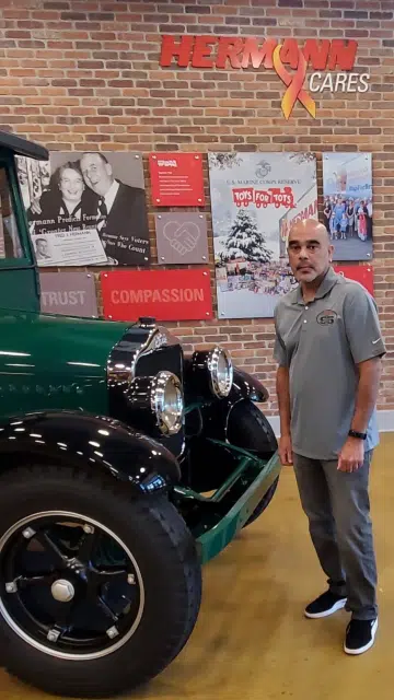a man standing in front of a truck