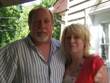 a man and woman posing for the camera