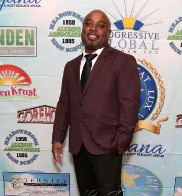 a man in a suit posing for the camera