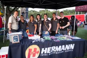 a group of people standing in front of a crowd