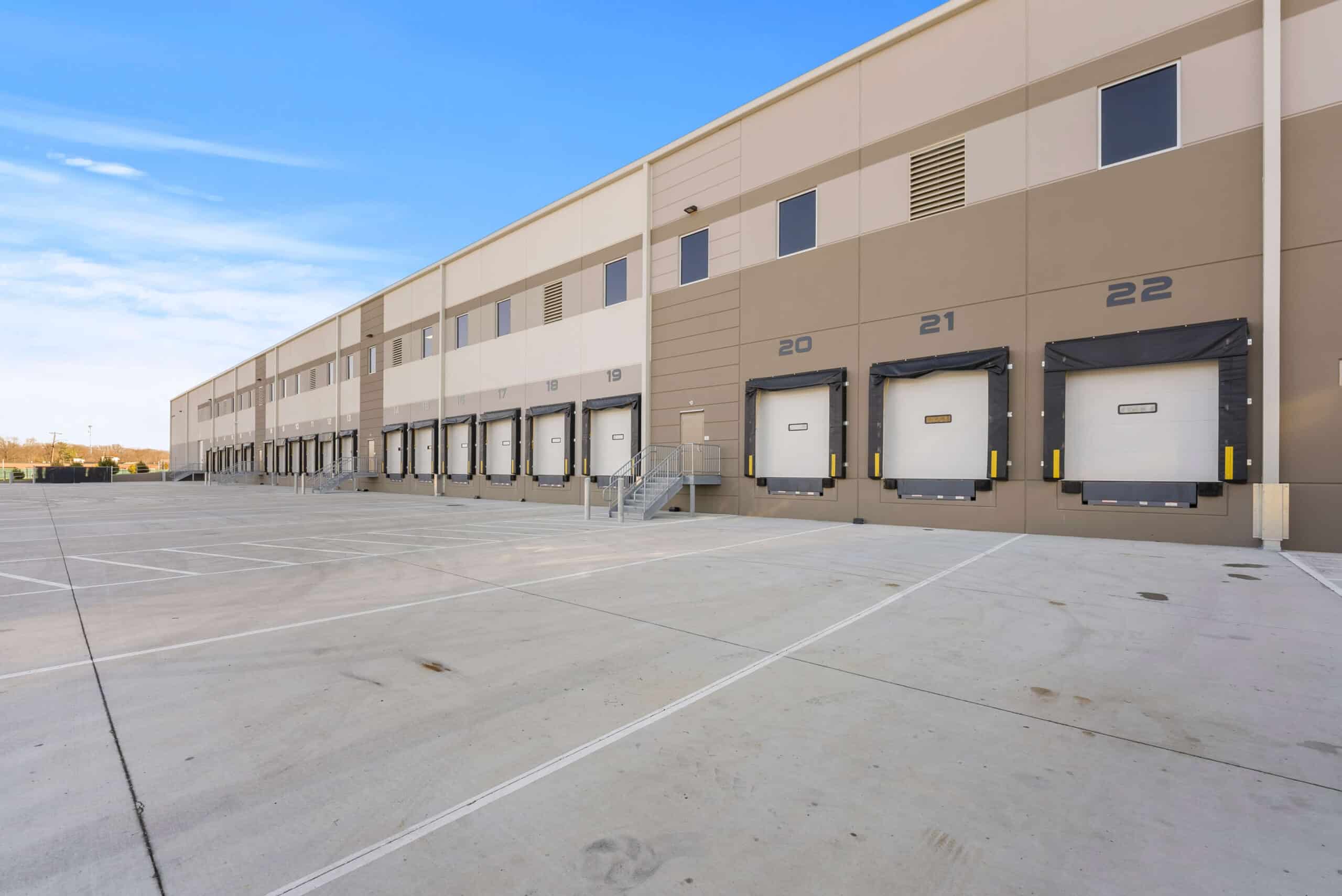 An warehouse with multiple large doors, providing ample space for storage and easy access.